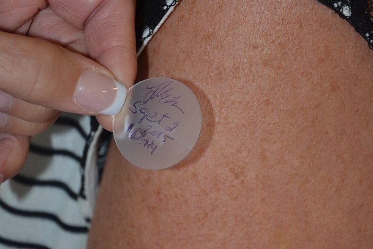 Adhesive for drug delivery system